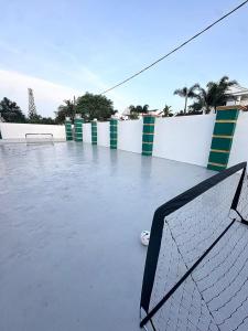 a tennis net sitting on a tennis court at Emerald Villa in Pasir Gudang