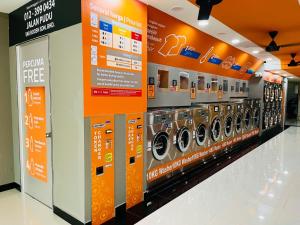 a row of washing machines in a store at Central City Hotel at Chinatown in Kuala Lumpur