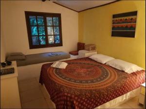 Ένα ή περισσότερα κρεβάτια σε δωμάτιο στο Linda Casa aconchegante com 3 quartos, vista incrível e privacidade na Praia da Aripeba-Ilha Grande-acomoda 8 pessoas