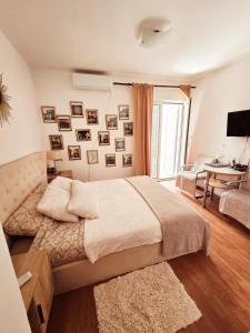 Ένα ή περισσότερα κρεβάτια σε δωμάτιο στο Apartments Nikčević