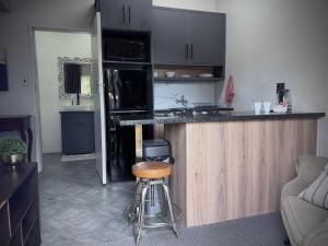a kitchen with a counter and a stove top oven at Olive Branch in Bethal