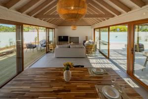a living room with a couch and a table at Pestana Comporta Village Residences in Comporta