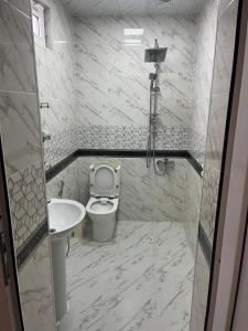 a bathroom with a toilet and a sink at Sheraton Luxury Villa in Baku