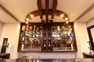 a bar with a lot of bottles of alcohol at Hotel Harmony in Kathmandu