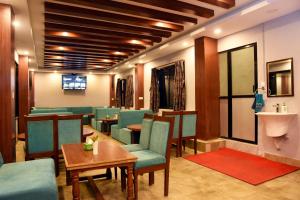 a waiting room with chairs and a table and a sink at Hotel Harmony in Kathmandu +37 photos