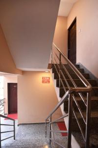 a set of stairs in a building with a door at Hotel Harmony in Kathmandu