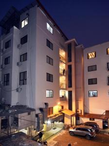 a building with a car parked in front of it at Hotel Harmony in Kathmandu