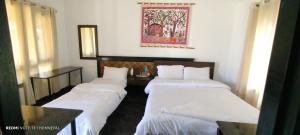 Krevet ili kreveti u jedinici u okviru objekta Siddhartha Kuti Resort