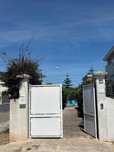 two white refrigerators are parked next to each other at Villa Ingrosso in Leporano Marina