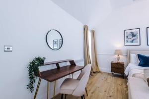 a living room with a table and a couch at Westminster House Studio - By Assured Stays in Hull
