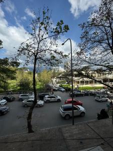 a parking lot with many cars parked in it at Apartament in Blloku in front of Taiwan in Tirana