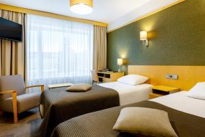 Postel nebo postele na pokoji v ubytování Hotel Tartu