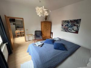 Postel nebo postele na pokoji v ubytování Art Apartment - Harz