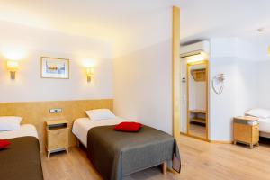 Postel nebo postele na pokoji v ubytování Hotel Tartu