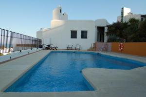 Bazén v ubytovaní Hostal El Dorado alebo v jeho blízkosti