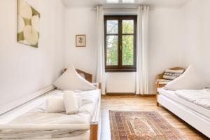 Postel nebo postele na pokoji v ubytování Bergwelten