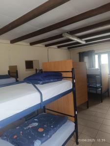 A bed or beds in a room at Albergue La Senda