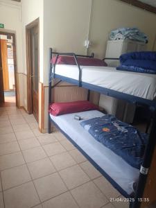A bed or beds in a room at Albergue La Senda