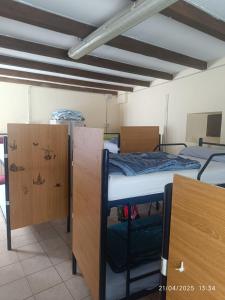 A bed or beds in a room at Albergue La Senda