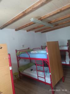 A bed or beds in a room at Albergue La Senda