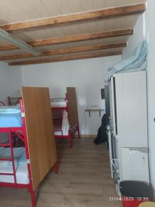 A bed or beds in a room at Albergue La Senda