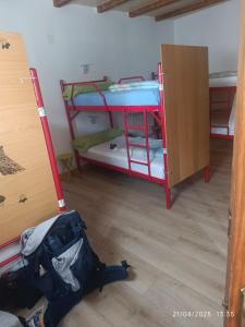 A bed or beds in a room at Albergue La Senda