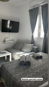 Postel nebo postele na pokoji v ubytování Dominik apartment