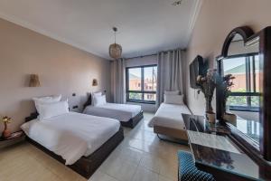 Postel nebo postele na pokoji v ubytování Amani Hotel Suites & Spa + 37 fotografií