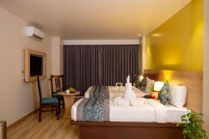 Postel nebo postele na pokoji v ubytování Velvet Luxe Hotel