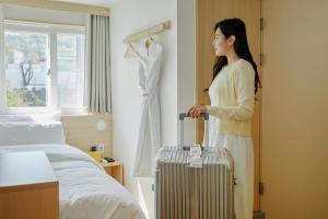 Hotel Marguerite Seoul房間的床