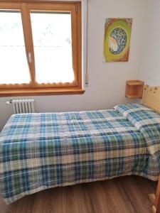 Postel nebo postele na pokoji v ubytování Casa Screm - Appartamenti e Camere -Rigolato - UD