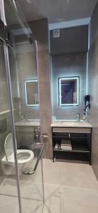 Ein Badezimmer in der Unterkunft Old Avenue Hotel
