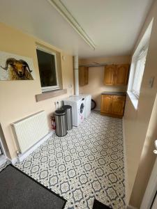 a kitchen with a washer and dryer in a room at Samieston Lodge, near Jedburgh in Whitton +15 photos