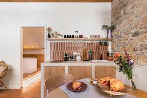 a kitchen with a table with chickens on it at La Suite Saint Georges in Lyon