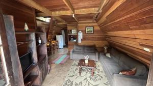 an overhead view of a living room in a log cabin at Vale do Piemonte "Chalés " in Santo Antônio do Pinhal