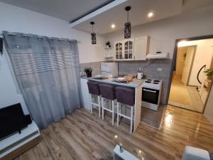 a small kitchen with a counter and a stove at Vavic 2 in Topla