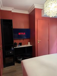 TV a/nebo společenská místnost v ubytování La Caravelle