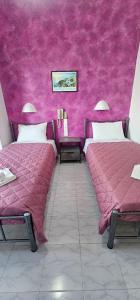 Ліжко або ліжка в номері Hotel Palladion