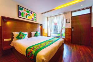 Katil atau katil-katil dalam bilik di Treebo Tranquil Heights With Scenic View