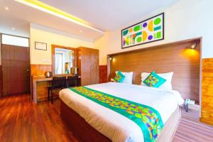 Katil atau katil-katil dalam bilik di Treebo Tranquil Heights With Scenic View