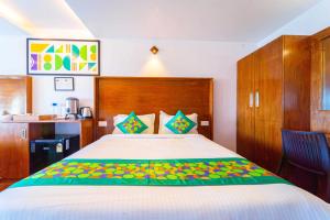 Katil atau katil-katil dalam bilik di Treebo Tranquil Heights With Scenic View
