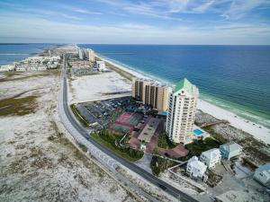 an aerial view of a beach with buildings and the ocean at Beach Bay Bliss in Navarre