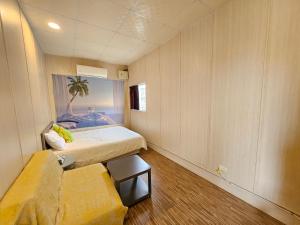 Postel nebo postele na pokoji v ubytování 舞浪海景旅店