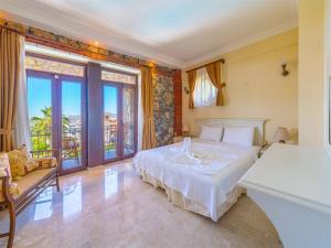 Postel nebo postele na pokoji v ubytování Lebrentals Aychin Villas + 14 fotografií