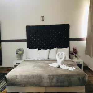 Voodi või voodid majutusasutuse Hotel velvet One toas