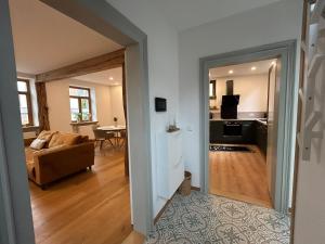 a view of a living room and kitchen from a hallway at Ferienhaus Haisel Vier in Sankt Martin