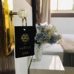 Voodi või voodid majutusasutuse Hotel velvet One toas