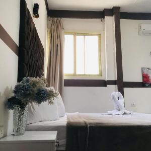 Voodi või voodid majutusasutuse Hotel velvet One toas