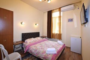 Postel nebo postele na pokoji v ubytování Villa Rosa