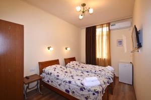 Postel nebo postele na pokoji v ubytování Villa Rosa + 26 fotografií